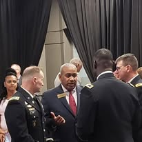 Allie Braswell speaking with United States Army officers