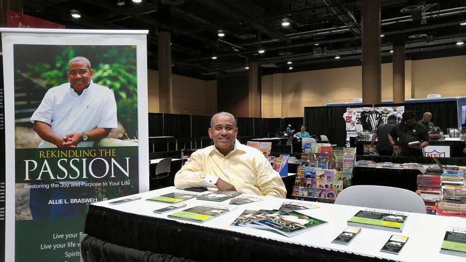 Allie Braswell presenting his published work at an authors event