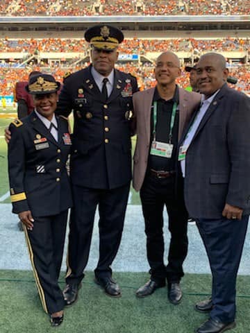 Allie Braswell with Lieutenant General Leslie Smith, Major General Donna Martin, and a Bethune-Cookman University leader